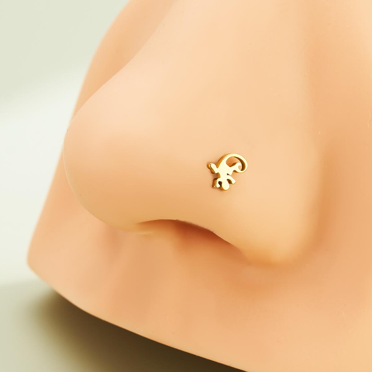 gold gecko nose piercing