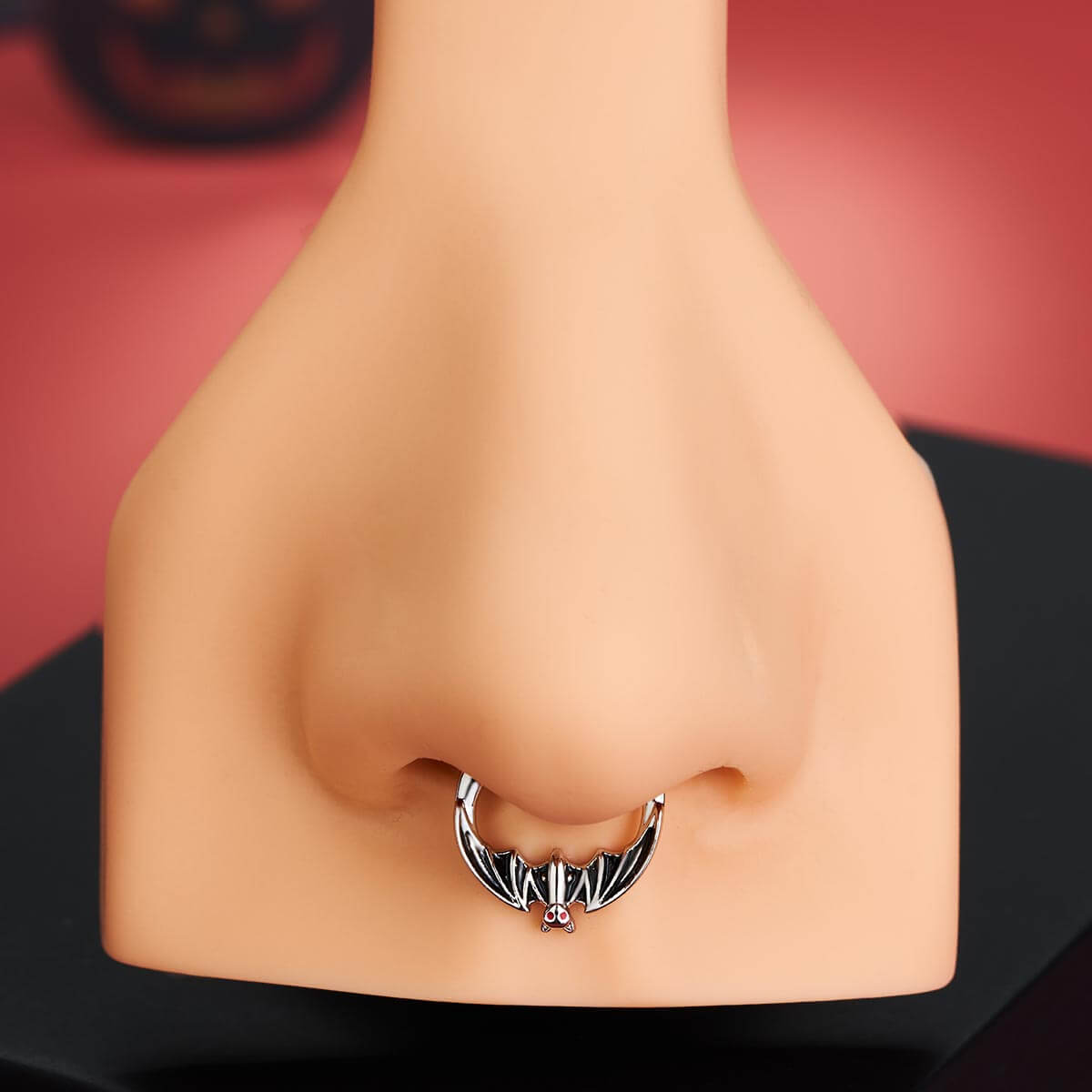 black spooky septum piercing